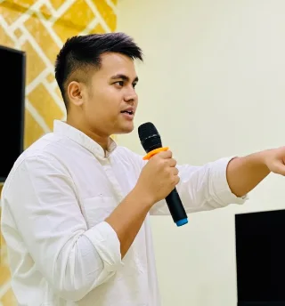 Classic Monks Founder speaking into microphone